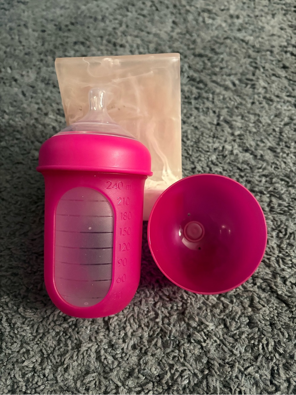 NWOT Boon 8 oz dark pink colored bottle with a lid